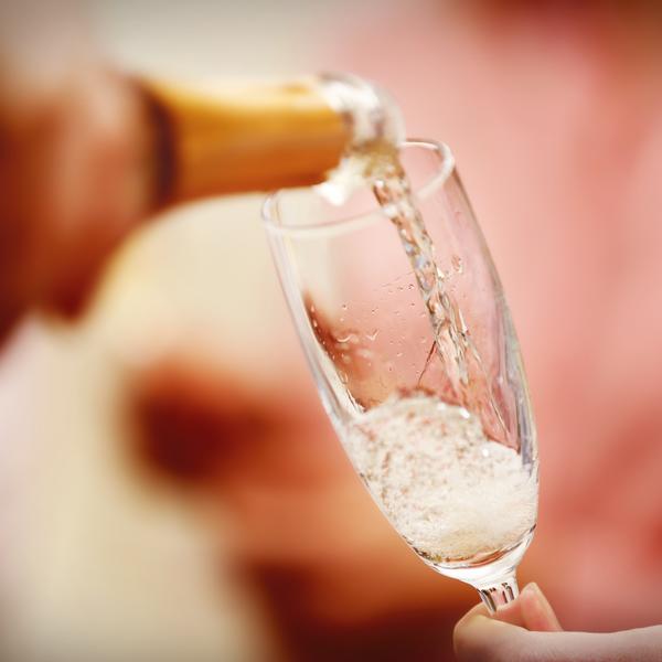 Champagne being poured in Reims, France