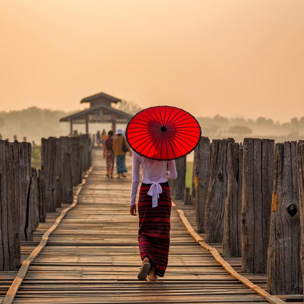 Girl with umbrella in Mandelay in Myanmar
